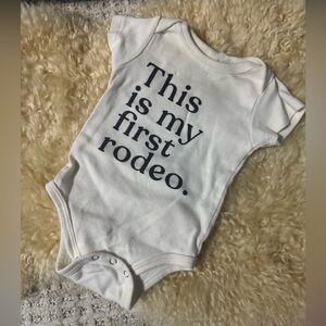 Charming White Baby Bodysuit - 'This is my first rodeo'